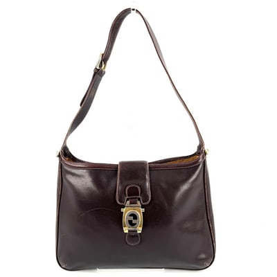 Gucci rich brown leather early Jackie style XL hobo style shoulder bag: This stunning Gucci Jackie hobo is crafted from rich brown leather with the iconic two-tone GG locking clasp and gleaming gold hardware. The XL size offers generous capacity for everyday essentials, w