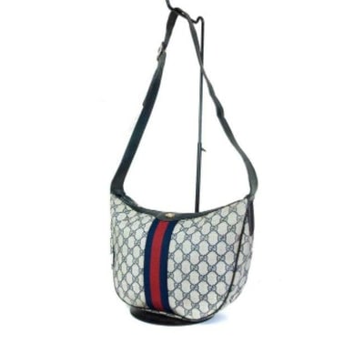 Gucci Shoulder Sherry Line With Red Blue Stripe Navy Guccissima Print Coated Canvas Leather Hobo Bag: For sale is a Gucci, navy blue Guccissima print coated canvas and leather, hobo style, shoulder bag with a red and navy center stripe! This is quality piece from Gucci that is a unique take on the cla