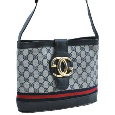 RARE, vintage Gucci, navy Guccissima print leather, satchel style, bucket bag with blue and red: For sale is a RARE, Gucci, navy Guccissima print canvas and navy leather, satchel style, bucket shaped, shoulder bag with an extra large, 'blondie'- like bold gold 'GG' emblem at the snap closure, a r