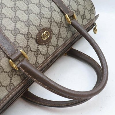 Gucci Boston Bag Ctd Cnvslthr Accessory Collection Brown Guccissima Print Leather And Coated Canvas: * For sale is a Gucci, brown Guccissima print coated canvas and brown leather Boston bag with two hard rolled handles, gold hardware, and lots of room! This is a great looking, classic purse from the