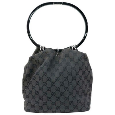 Gucci Vintage Black Large G Logo Print Canvas And Black Leather Accents: For sale is a Tom Ford era Gucci, black Guccissima print canvas and black glossy leather, chrome ring top, bucket style satchel purse with a round, black resin handle, chrome accents, black glossy