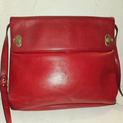 Ferragamo Gancini true red leather bucket style shoulder bag: Ferragamo as re-released this bag & it is on Vogue's list of must have styles this season.For sale is a vintage, Ferragamo, mod, Gancini, true red leather, bucket style shoulder bag! This is a gor