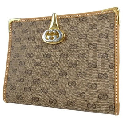 Gucci Brown Micro G Logo Print Vintage Guccissima Wallet: For sale is a vintage, Gucci, brown micro Guccissima print coated canvas and camel leather, bi-fold style wallet with a gold and silver, hinged 'GG' logo clasp, gold corner caps, a snap close change p