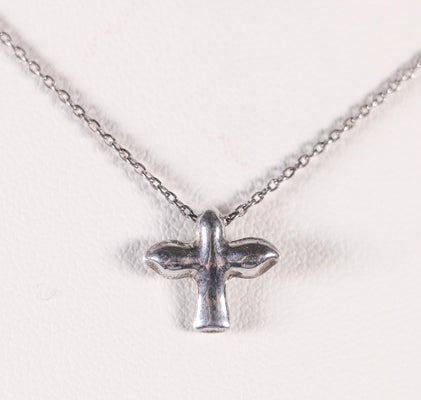 Tiffany discontinued peace dove or cross pendant on a 16" chain: For sale is a discontinued peace dove or abstract cross pendant by Tiffany & Co. on a 16" Tiffany & Co. chain in sterling. It is a perfect everyday necklace! Dimensions: Pendant: 1" in diamete