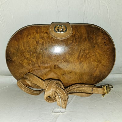 Gucci brown marbled leather oval shaped hard & boxy two-way purse: For sale is a unique, OoaK, 1970s Gucci brown marbled leather oval shaped hard & boxy two-way purse with a clamshell style opening, a snap closure, a gold GG accent, a removable strap, & gold 