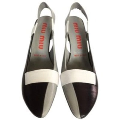 Miu Miu Black Grey White Slingback Wedge Heel: For sale is a pair of Miu Miu, size 38 EU, black, grey, white leather, slingback heels with a patchwork design, almond shaped toes, an elastic sling back, and 3" wedge heels! These create a perfect mo