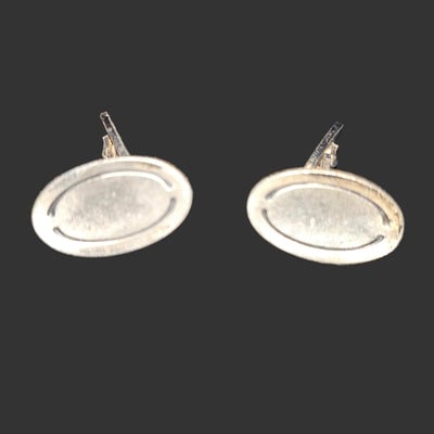 Georg Jensen sterling silver cufflinks with oxidized & engraved design: Georg Jensen sterling silver cufflinks represent the pinnacle of Scandinavian craftsmanship and timeless elegance. These distinguished accessories feature the brand's signature oxidized finish paired 
