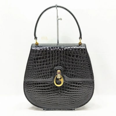 Gucci black crocodile boxy satchel with a red and blue enamel G clasp: For sale is a one of a kind, early Gucci, 1960's mod, round, hard and boxy, structured, crocodile leather, top handle shoulder bag with gold, equestrian-style hardware, a G logo red and blue enamel an