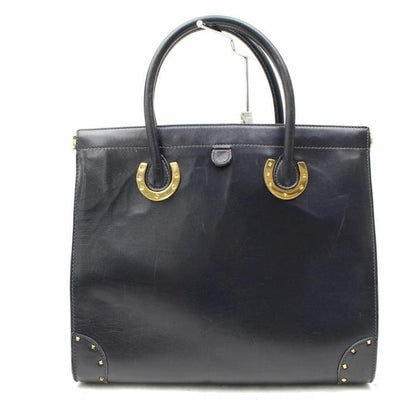 Gucci Horsebit Vintage Pursesdesigner Purses Navy Blue Leather With Gold Horse Shoe Accents Satchel: ** ONE OF A KIND STYLE! ** For sale is an early, Gucci, mod look, buttery soft dark navy blue leather, shoulder or handheld satchel style purse with two hard leather handles, a hinged opening, a foote