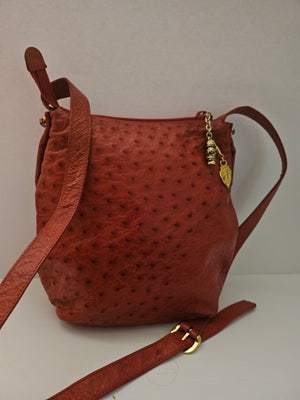 Gucci red ostrich leather cross body bucket bag: For sale is a vintage, Gucci, red ostrich leather and red leather, shoulder or cross body, zip top closure, bucket style bag with an adjustable strap and gold GG engraved hardware! This rare Gucci sty
