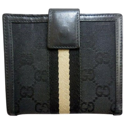 Gucci Black Large G Logo Print Canvas And Black Leather With A Black And Stone Fabric Center Stripe: For sale is a Gucci, black large G logo print canvas and black leather, snap close, bi-fold wallet with a wide black and stone fabric center stripe, chrome accents, a snap close change purse, and lots