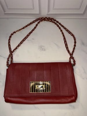 Authentic Fendi Red Pequin Embossed Leather Claudia Flap Bag: Elevate your vintage accessory collection with the strikingly luxurious Fendi Red Pequin Embossed Leather Claudia Flap Bag. Originally debuting in the 2012-2013 collections, this timeless shoulder bag