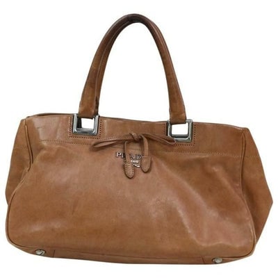 Prada Way Top Handle Light Coffee Brown Leather Satchel: For sale is a Prada, 'Bow Ribbon' super soft light coffee brown leather, two way style top handle satchel or cross body purse with chrome hardware, a removable and adjustable strap, a footed bottom, a