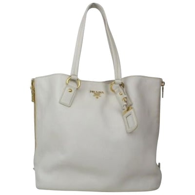 Prada ivory grained leather Vitello Daino XL tote bag: For sale is a Prada, Vitello Daino, XL tote bag in ivory grained leather with two longer flat leather straps, bold gold hardware, zippers so the handbag can expand on both sides, a removable name tag,