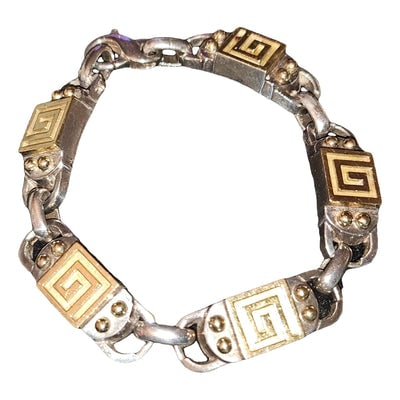 metallic yellow gold Givenchy bracelet: For sale is an AMAZING, Givenchy bracelet in 18k gold and sterling, chunky and substantial 'G' links! A look from the past that is just as stylish today! The bracelet is beautiful! This is a classic, 