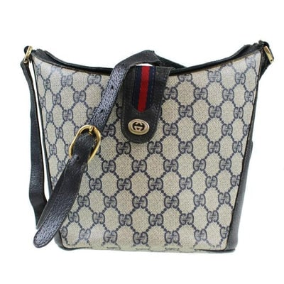 RARE, Gucci, navy blue Guccissima print leather, bucket bag w red & navy striped, top strap & gold: For sale is a RARE, Gucci, navy blue Guccissima print coated canvas and leather, satchel/bucket style cross body/shoulder bag with a red and navy blue striped, top strap that snaps at a gold GG logo a
