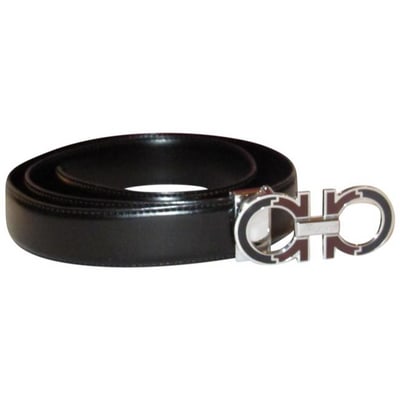 Ferragamo Black/Brown Belt w Chrome Buckle: For sale is an iconic, Salvatore Ferragamo, black leather, 1.4" wide, 45" long belt with a 3.5" x 1.5" double Gancini, chrome buckle with inlaid black and brown enamel, holes from 37" to 41" and a rem
