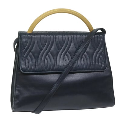 Fendi navy blue leather pasta stye two way purse with hard gold top handle: For sale is a unique, vintage, 1970's Fendi navy blue leather pasta style two-way purse with a hard gold top handle. A classic Fendi piece that seamlessly transitions from day to evening wear, offerin