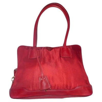 Prada nylon & red leather shoulder bag w chrome & lock/key: For sale is a Prada, nylon and red leather, two straps, zipper top style, shoulder bag with chrome hardware, lock and key! This is a stunning handbag from Prada in one of its iconic designs with lots 