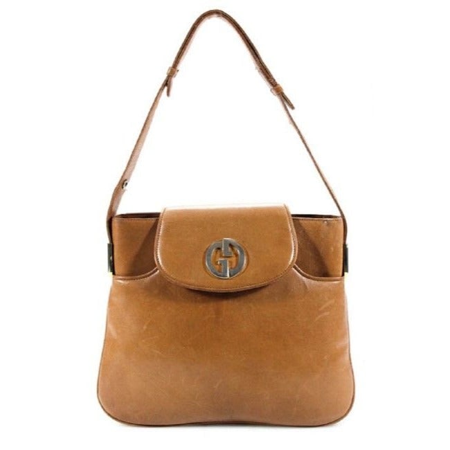 Gucci 1973 camel leather handbag w gold GG & lots of room: For sale is a unique, vintage, mod, Gucci, camel leather handbag with a gold GG flap snap lock! It is a unique vintage style that would be a great used as your signature camel purse! Gucci brought bac