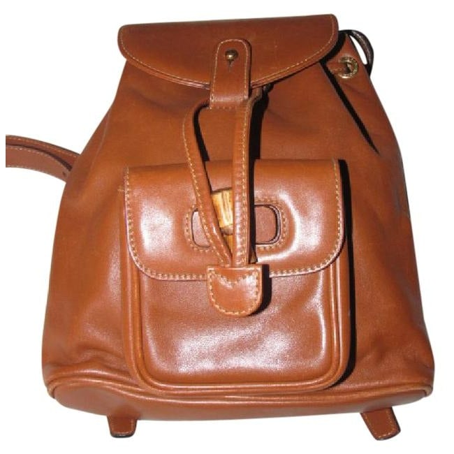Gucci Vintage Pursesdesigner Purses Caramel Brown Leather Backpack: For sale is a Gucci caramel brown colored leather, two strap, petite, drawstring top, multi-pocket, messenger bag/backpack with gold and bamboo accents! This gorgeous,yet practical piece is still bein