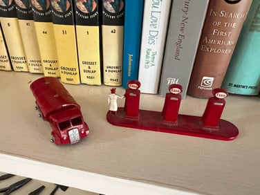 Vintage toy gas station setup
