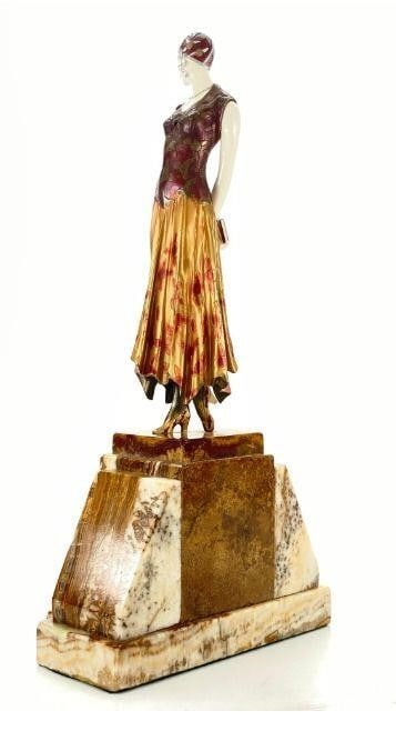 Bronze & Bone Sculpture: Dimitri Haralamb Chiparus (1886 - 1947) Young Lady Holding Books Bronze Sculpture. Signed on marble base. The left right arms and the head appear to be Bone. Artist: Dimitri Chiparus Title: Young Lady