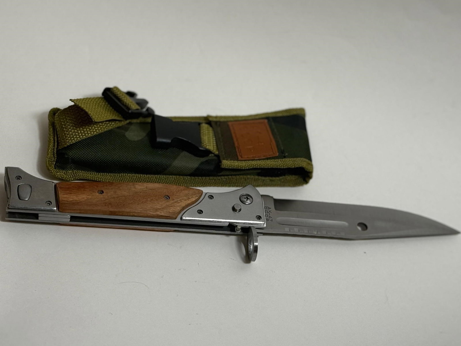 AK-47 USSR (CCCP) Bayonet Pocket Knife: Dimensions: 7.5in x 2.5in x 1inBayonet Features: It includes a muzzle ring (the small ring/loop near the crossguard) and the hole in the blade (visible in the image) which are used in conjunction with