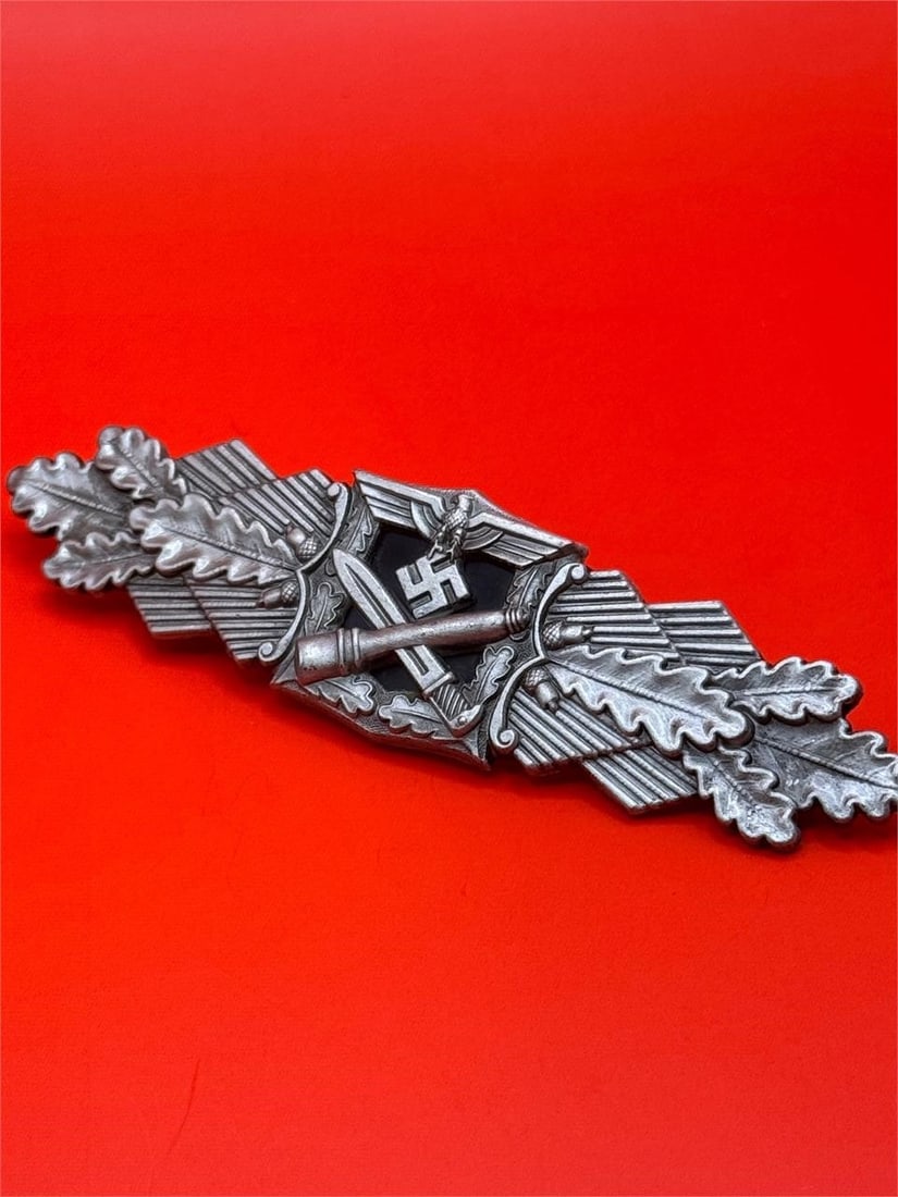 WWII German Silver Close Combat Clasp: Dimensions: 3.5in x 1ina German military award from World War II. It was instituted on November 25, 1942, to recognize soldiers who engaged in hand-to-hand combat. The award was issued in three grades