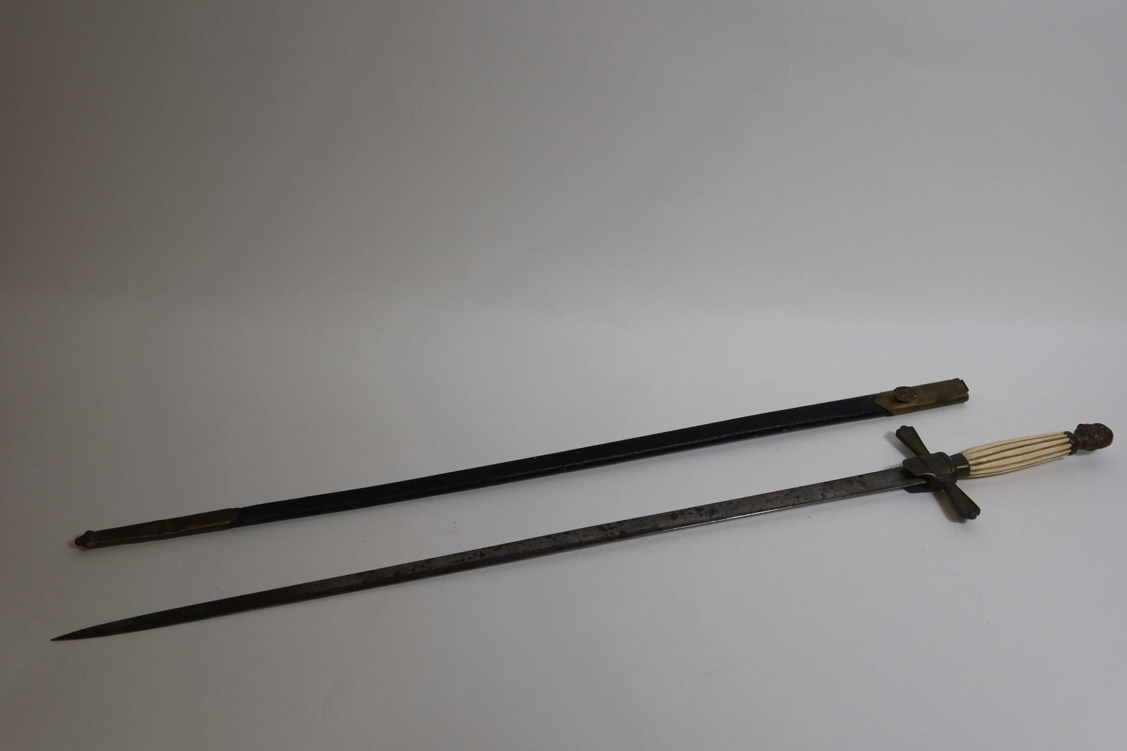 Antique sword with leather scabbard: Blade length: 29 inchesFull Length: 3 FT