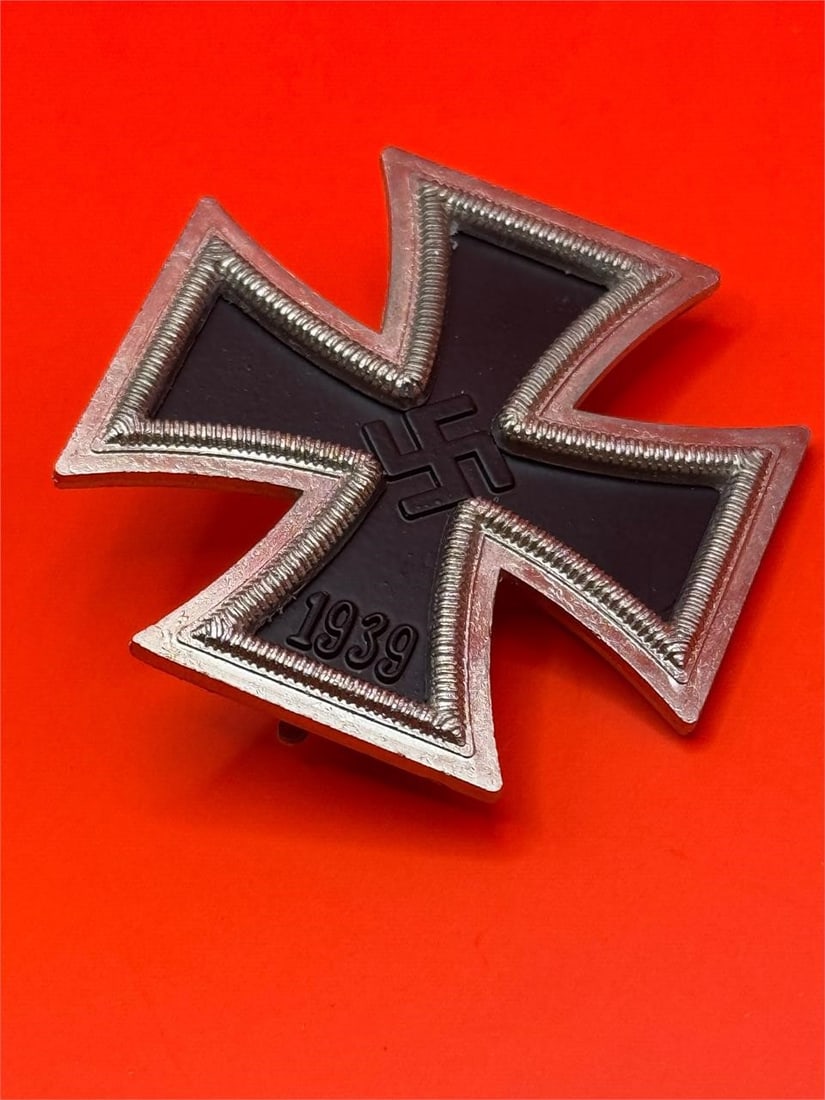 World War II German 1939 Iron Cross: Dimensions: 3.5in x 2.5in x ¾ inThe image displays an original World War II German 1939 Iron Cross 1st Class medal (Eisernes Kreuz I. Klasse), a high-ranking military decoration re-instituted b