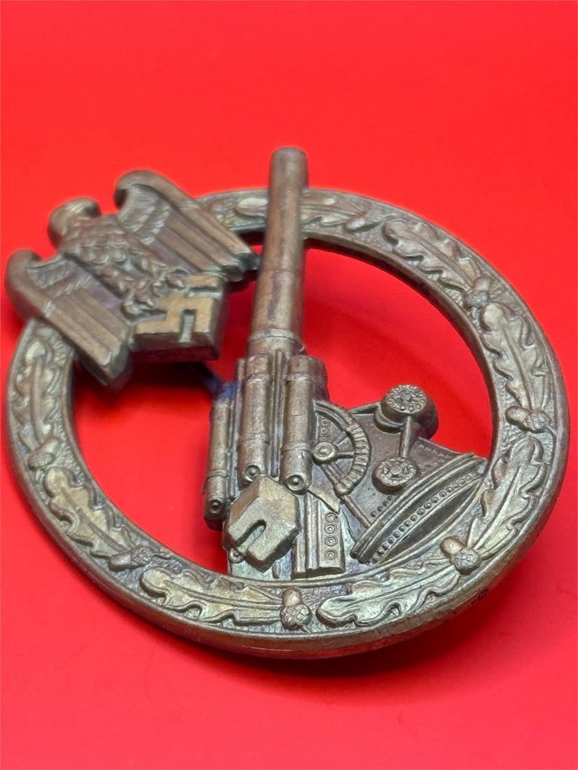 WWII German Army Anti-Aircraft Badge: Dimensions: 2.5in x 2inThis military decoration was awarded to German Army personnel for service in an anti-aircraft battery during World War. Historical Context: The badge was instituted on July 18, 