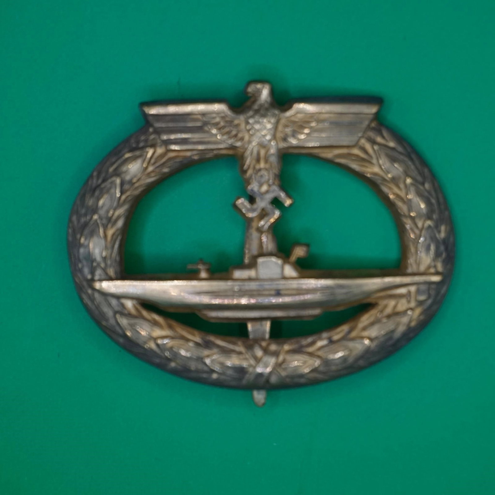 Kriegsmarine U-Boat Badge: An uncommon early-war tombac U-Boot Abzeichen with the distinctive Petz & Lorenz design and setup. The badge remains in excellent, lightly worn condition, with most of the original gilding still visib