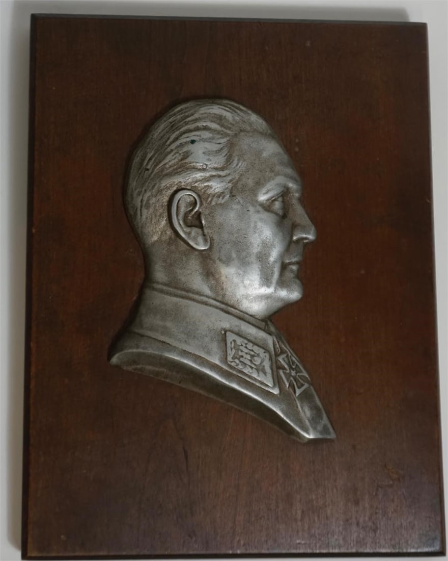 German WWII Era Goering Bust: German WWII-era propaganda relief Hermann Goering Bust Plaque, cast metal profile mounted on wood. Reverse bears a German nationalist quotation attributed to Adolf Hitler with English translation. Per