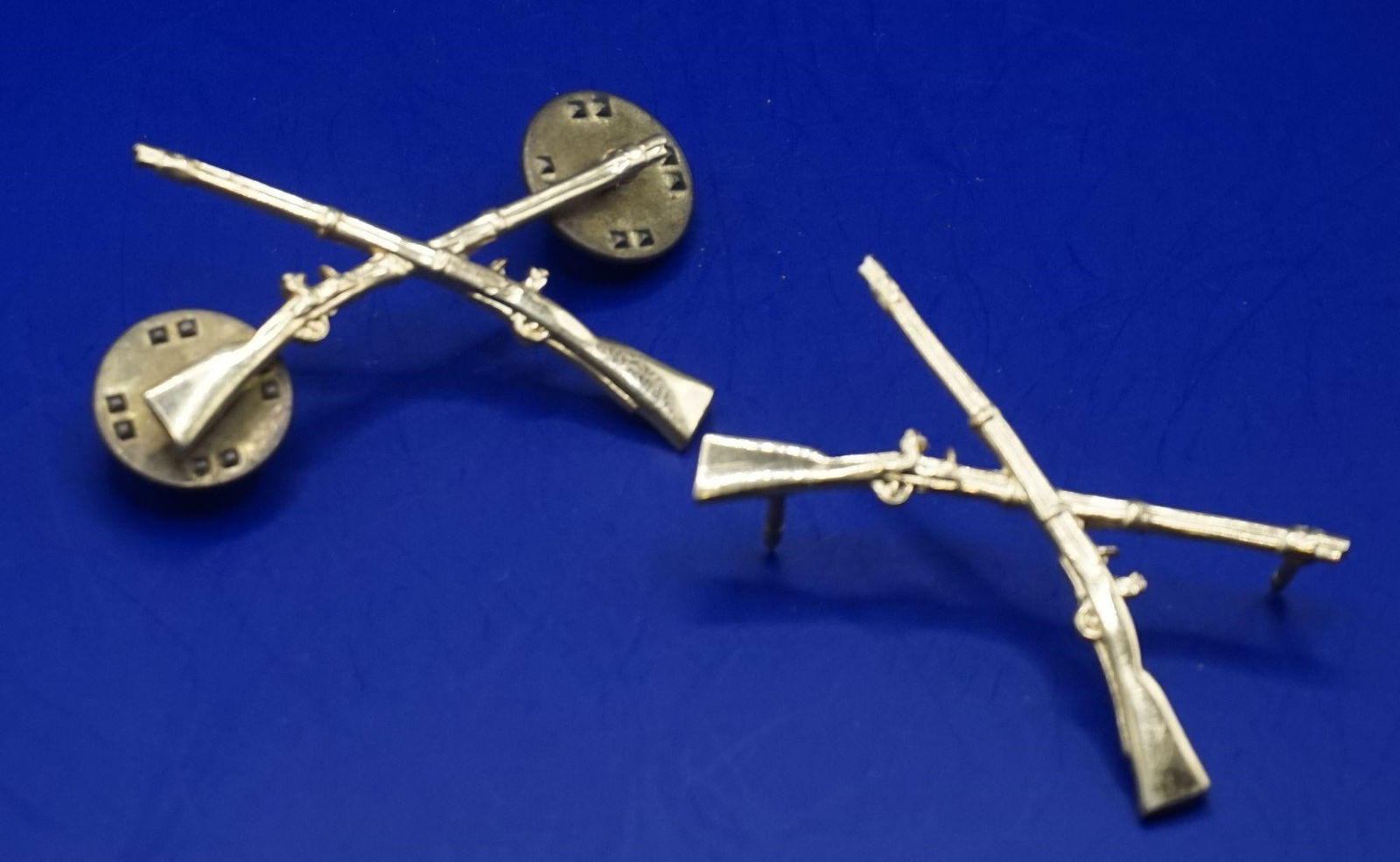 WWII Vintage US Army Infantry Officer Rifle Pins: These are vintage U.S. Army Infantry Officer's crossed rifle insignia pins. The design, featuring crossed rifles or muskets, was introduced for Infantry officers and soldiers in November 1875. These a