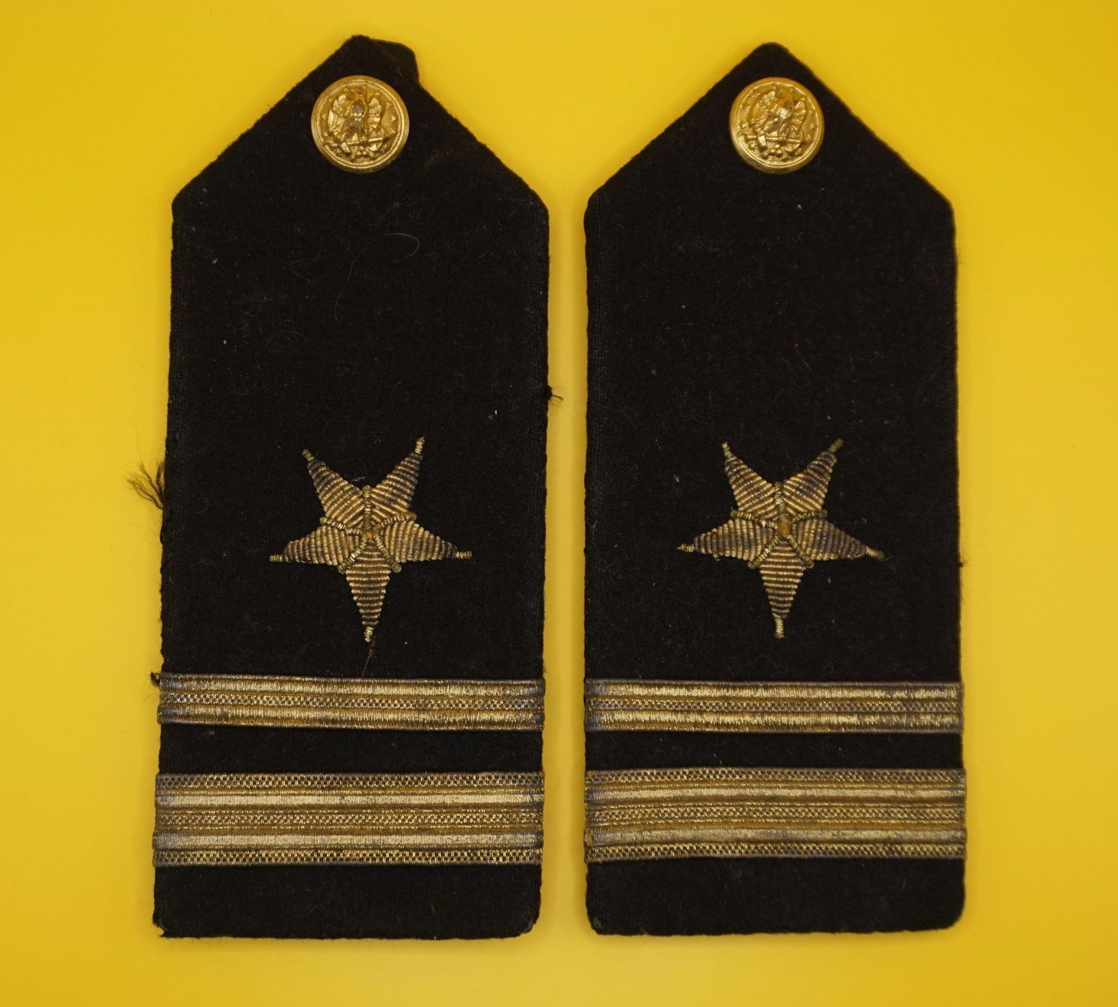 US Navy Officer Rank Lieutenant Jr Shoulder Board: These are United States Navy line officer's hard shoulder boards. The black wool fabric and gold trim denote a Navy officer's uniform insignia. The single embroidered star indicates a "line officer" (
