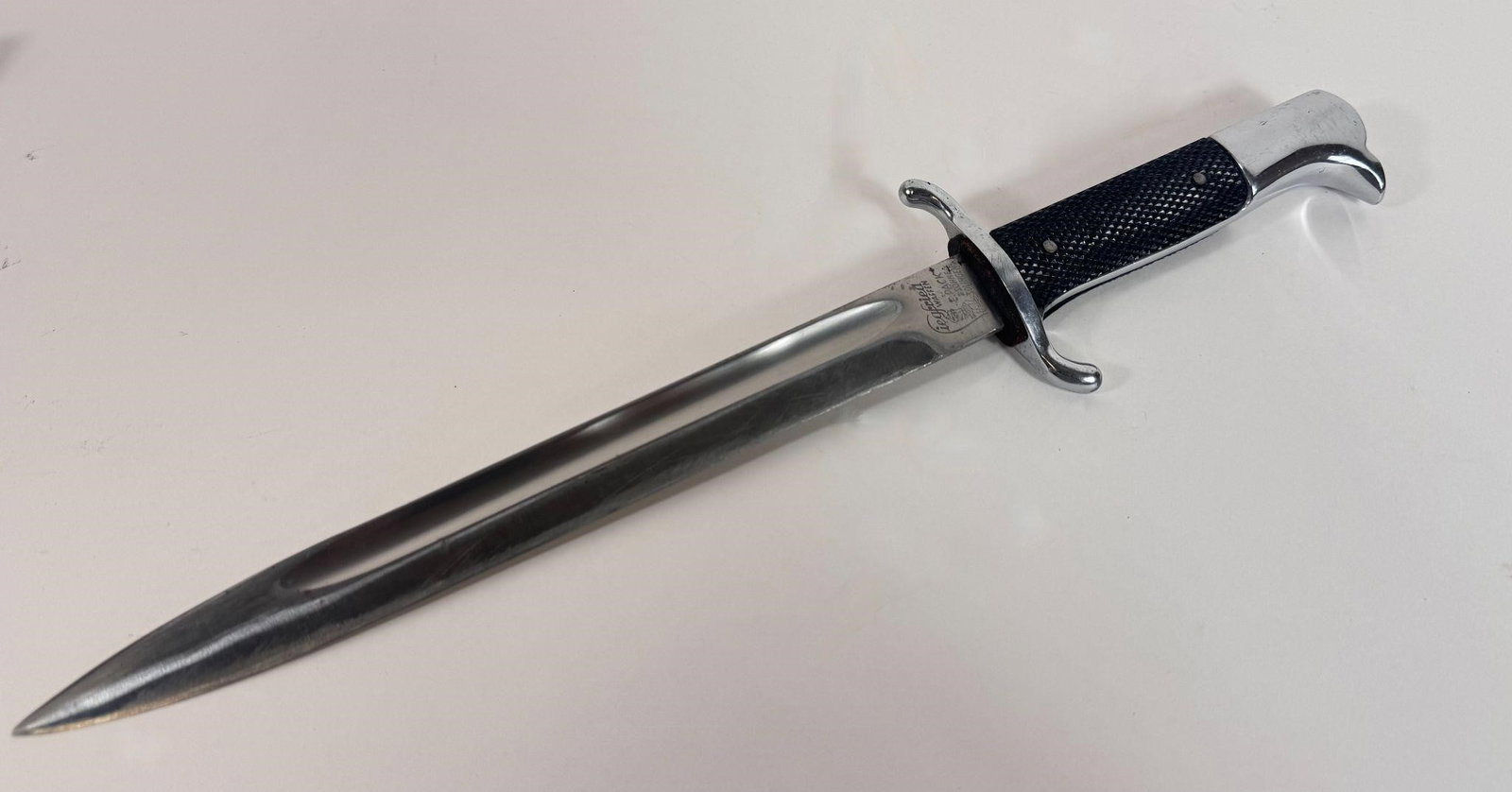 WWII FIREMEN DRESS BAYONET & SCABBARD SOLINGEN: The WW2 German Fireman's Dress Bayonet was a ceremonial sidearm worn by Feuerschutzpolizei (Fire Protection Police) personnel with their walking-out or evening dress uniforms. Unlike combat bayonets,