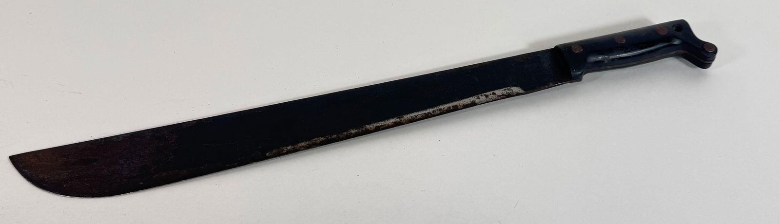 WWII Era US Army 18" Machete & Canvas Scabbard: The item you have is a WWII-era U.S. military 18-inch machete and canvas scabbard, a common piece of field gear used during the war. These were issued to various personnel, including Army soldiers and