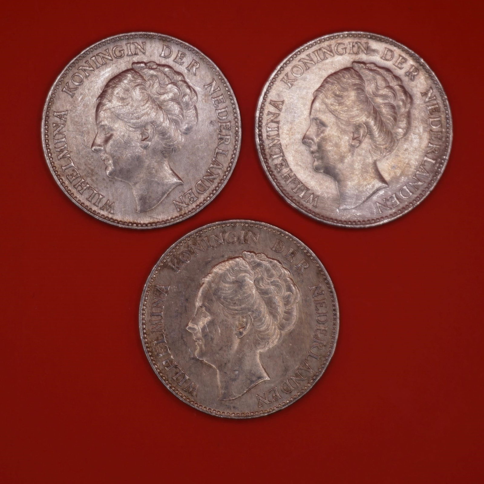 1939 Netherlands Queen Wilhelmina Silver Gulden: Three 1939 Netherlands silver 1 Gulden coins featuring Queen Wilhelmina, struck in .720 silver and issued just before WWII.