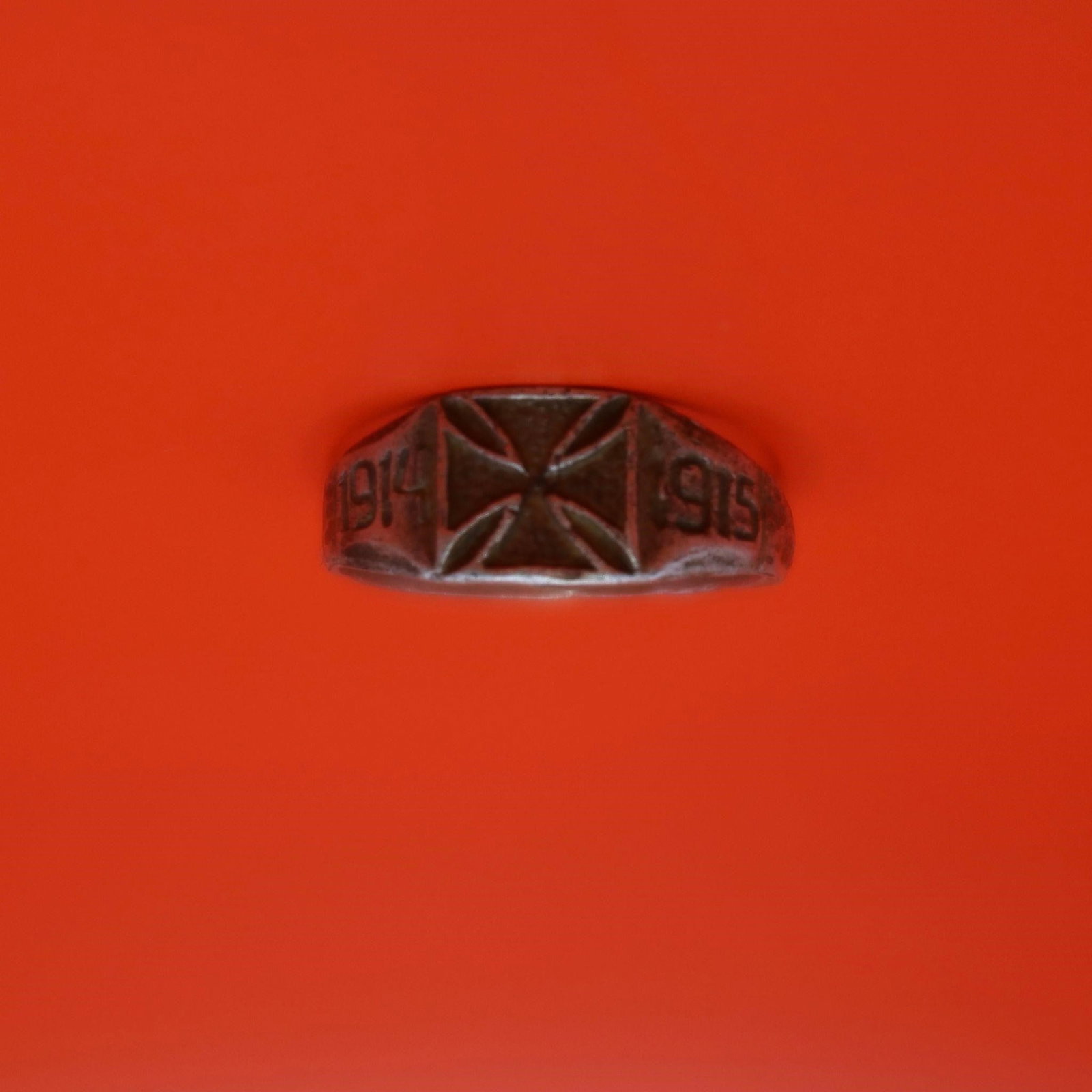 WWI German Silver Ring: WWI German Silver Ring featuring a raised Maltese-style cross on the front and simple engraved side details. Shows age wear and patina throughout, giving it a well-worn antique look.