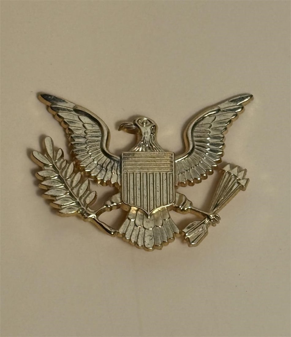 US Military Badge: U.S. military insignia, specifically an officer's cap or breast badge featuring the Coat of Arms of the United States.Dimensions: 2.5in x 2in
