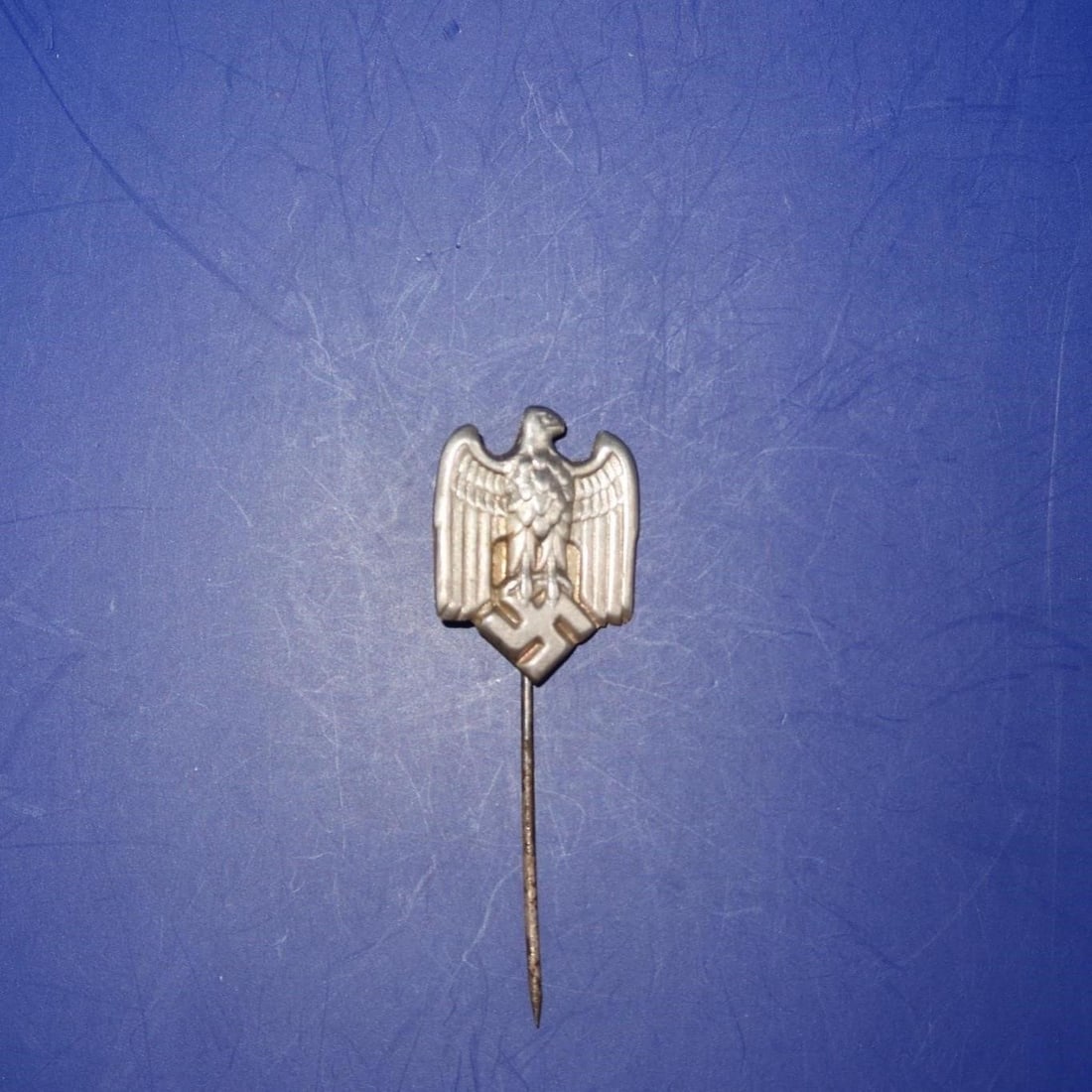 WWII German Army Eagle Lapel Badge.: Authentic Third Reich miniature lapel pin, privately purchased for civilian wear, made as an exact replica of the full-size award. Silvered Wehrmacht-style eagle with down-swept wings and crisp