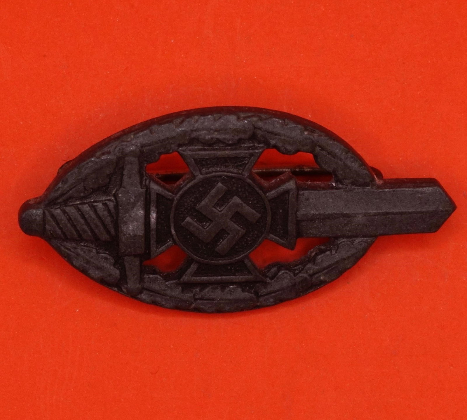 Germany III Reich NSKOV Badge: German Third Reich NSKOV (National Socialist War Victim's Care) badge, metal construction with pin back, typical period design, good condition.