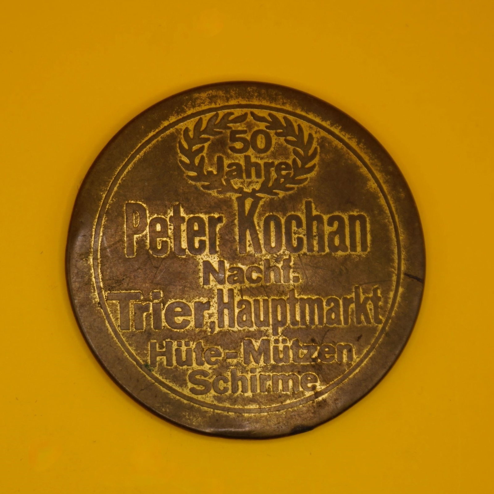 Peter Kochan 50th Anniversary Commemorative Medal: Commemorative token or medal celebrating the 50th anniversary of Peter Kochan, a business located at Trier Hauptmarkt. Good condition.