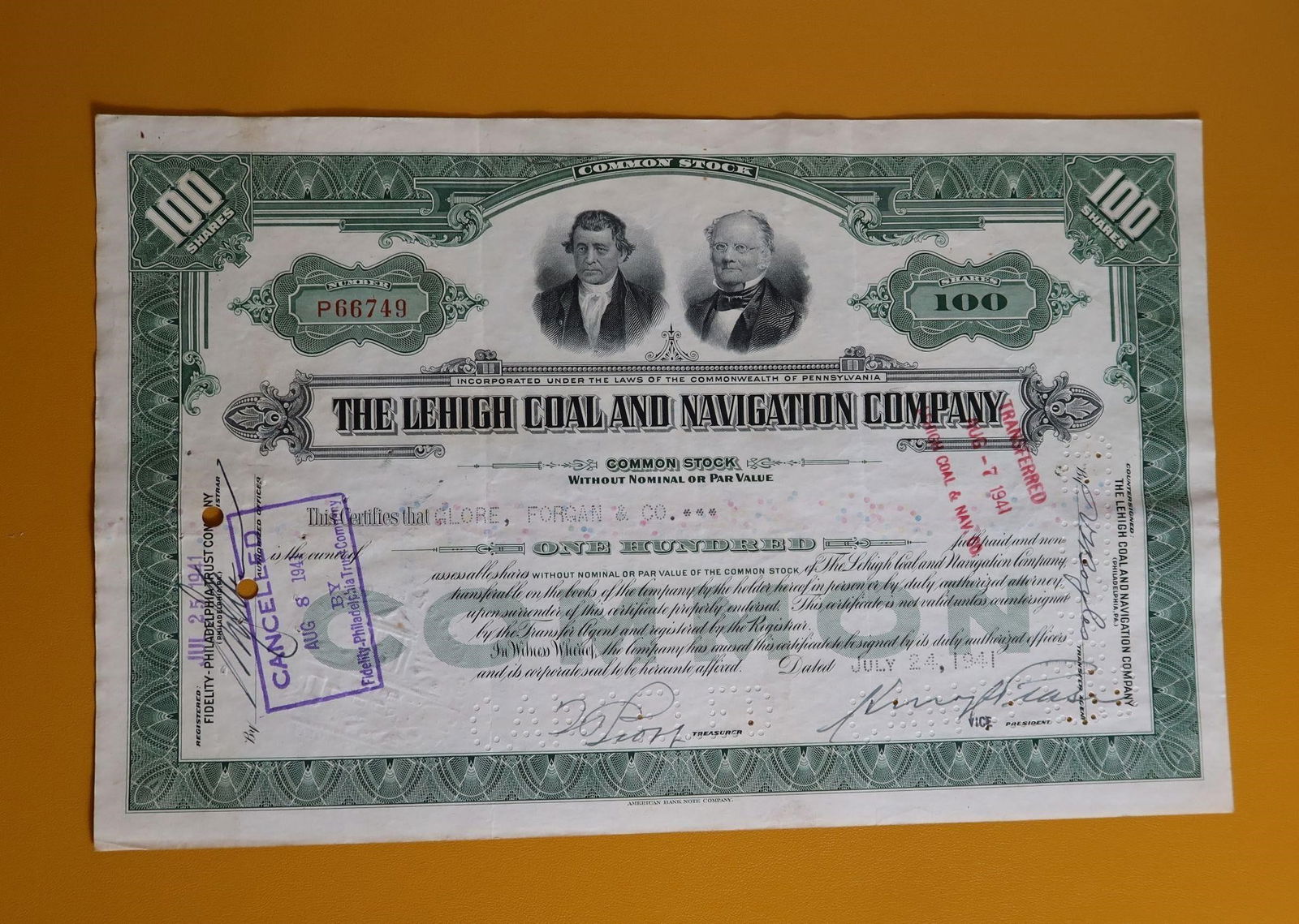 L Coal & Navigation Co 100 Share Stock Certificate: A collectible 100-share common stock certificate for The Lehigh Coal and Navigation Company, issued on July 24, 1941. The certificate features engraved portraits of the company's founders. It was