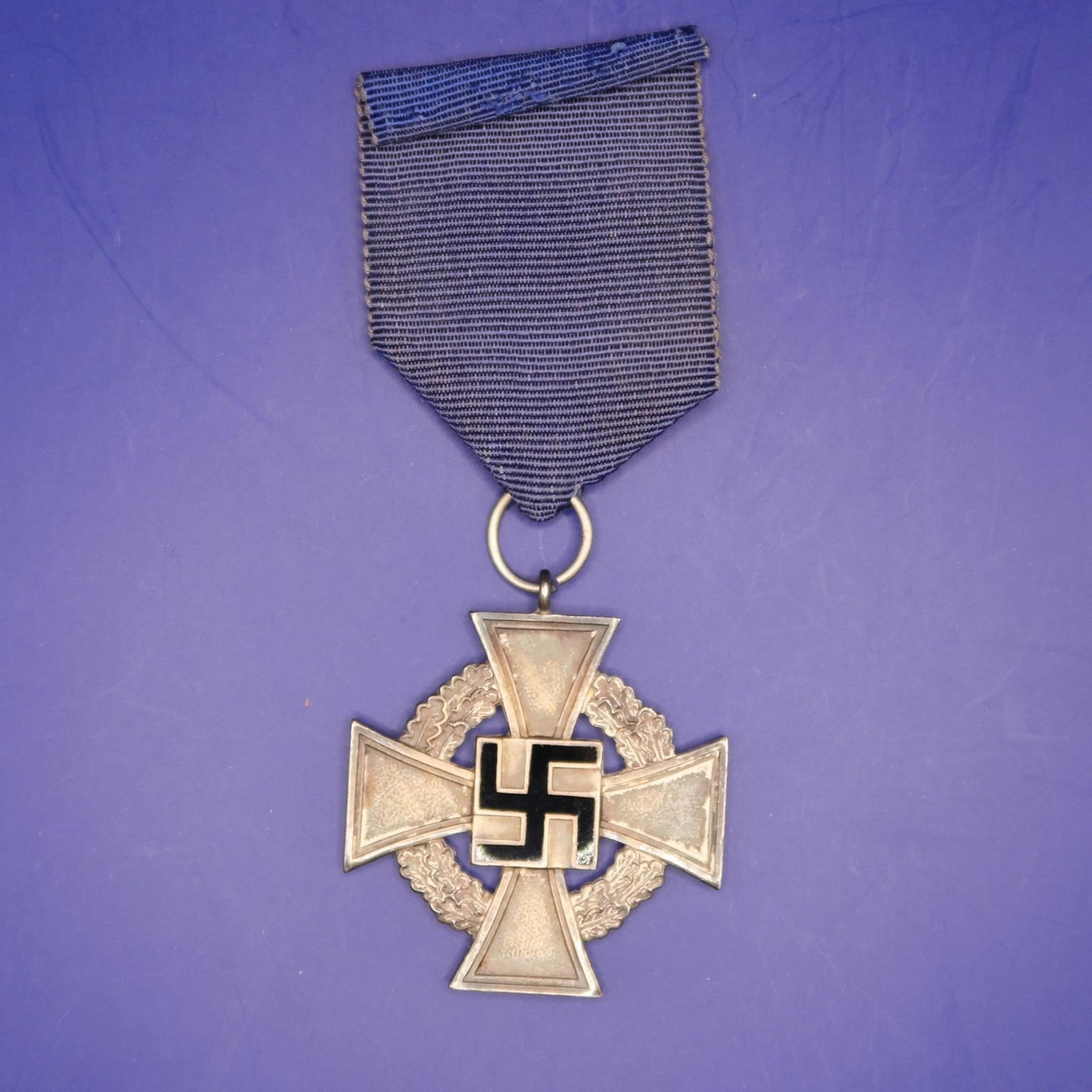 WWII German 25-Year Faithful Service Medal: WWII German 25-Year Faithful Service Medal, instituted on January 30, 1938, to honor civilian employees with at least 25 years of loyal service. The silver cross measures approximately 43 mm across, i