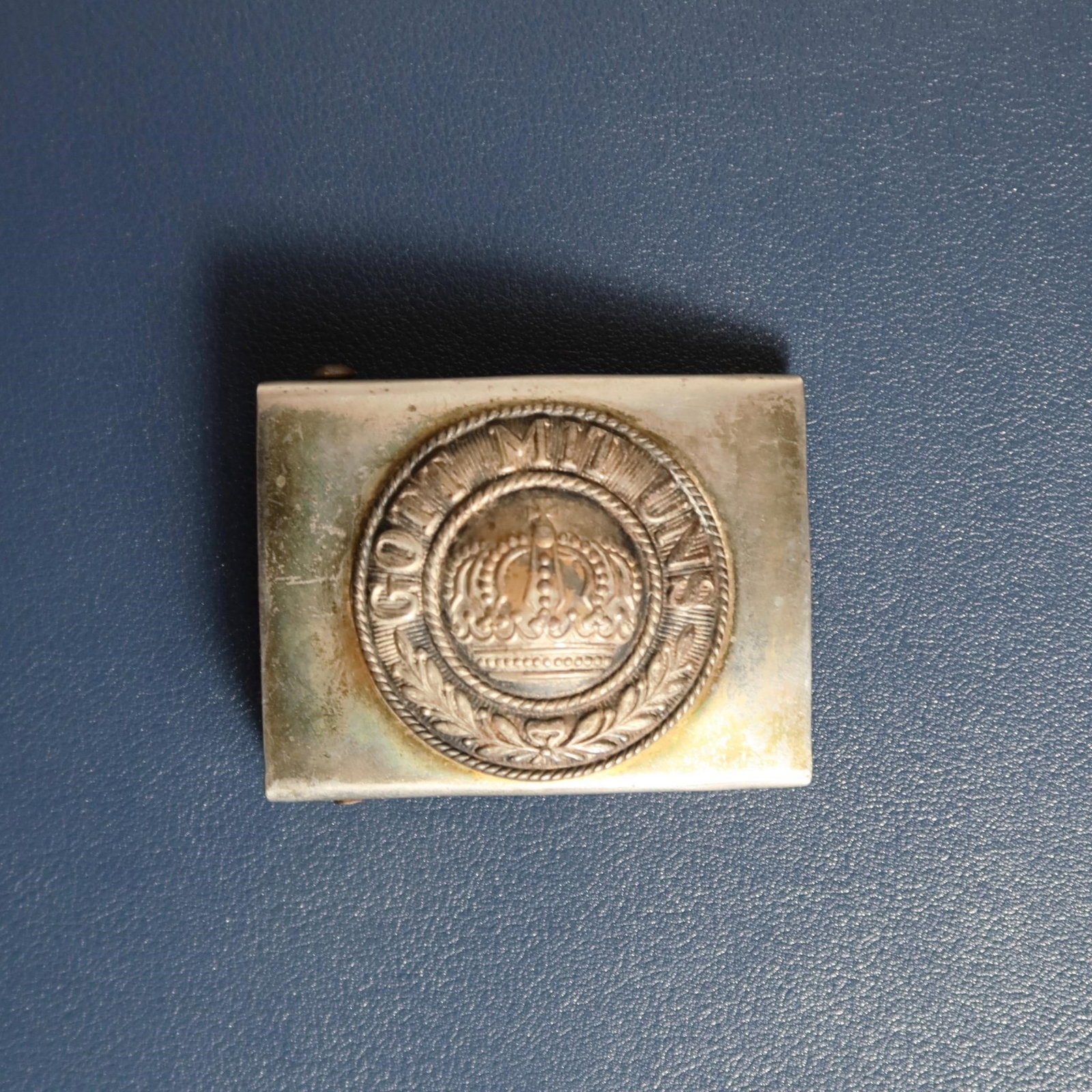 WWI Prussian M1895 EM/NCO Belt Buckle: Two-piece brass and nickel-silver Prussian box buckle of the 1895 pattern, measuring approximately 47 mm wide with a slightly convex profile. Obverse features a domed central crown, surrounded by a du