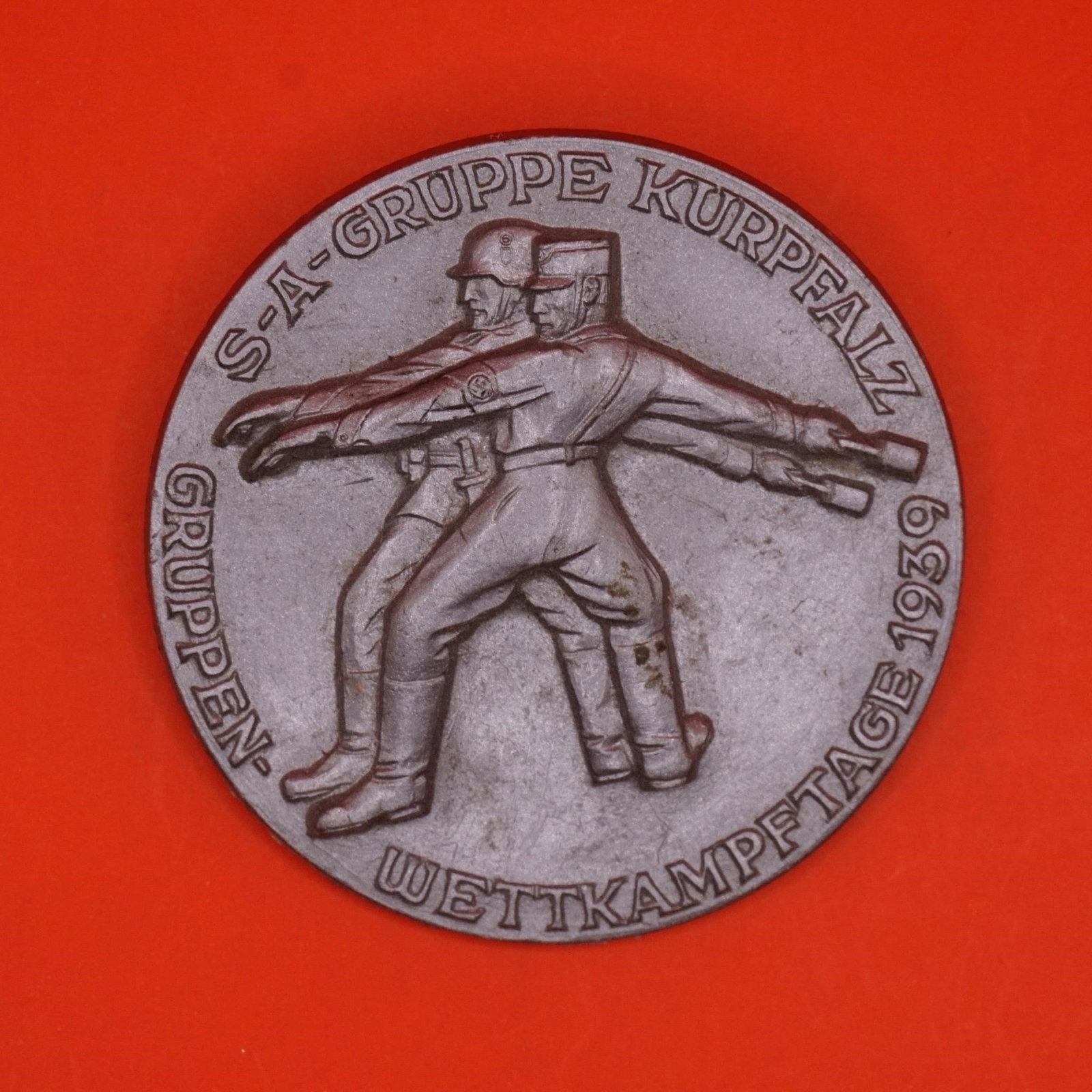 S.A. Gruppe Kurpfalz Wettkampftage 1939 Badge: 1939-dated commemorative badge issued for the S.A. Gruppe Kurpfalz Wettkampftage. Period example showing typical age-related wear.