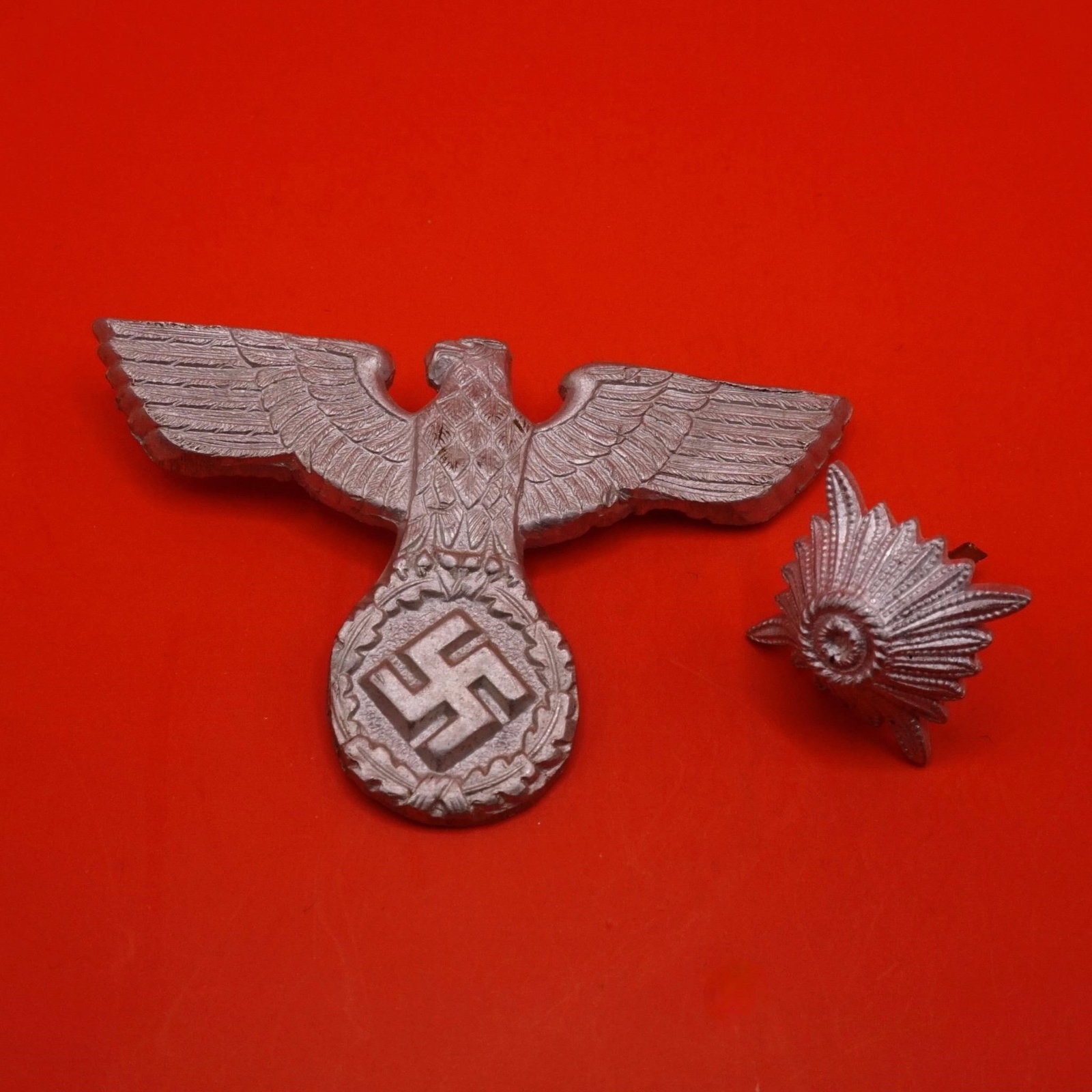 German NSKOV Badge & Wehrmacht Rank Star: German Third Reich NSKOV (National Socialist War Victim's Care) badge and original WWII Wehrmacht soldier metal rank star pip, both metal, pin-backed, typical period designs, good condition; sold toge