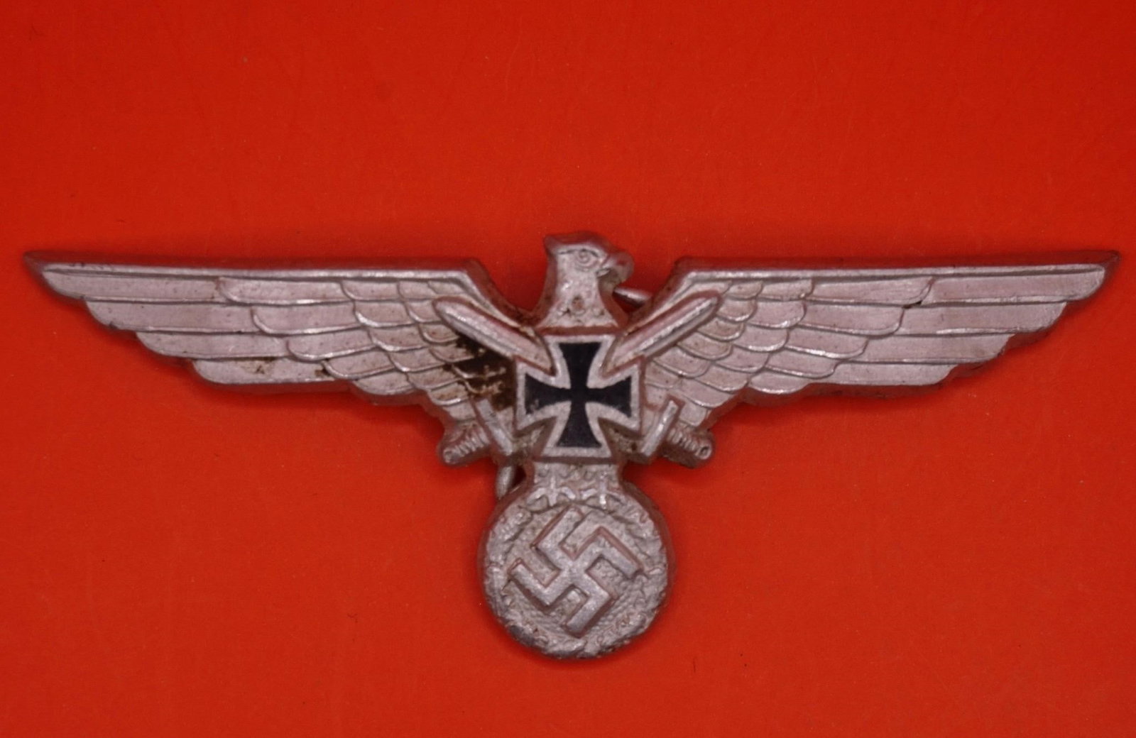 Original WWII German NS-RKB Member's Breast Eagle: Original WWII German NS-RKB (National Socialist Reichskriegerbund) member's breast eagle, injection-molded aluminum with silver wash, left-facing eagle clutching a wreathed swastika with Iron Cross an